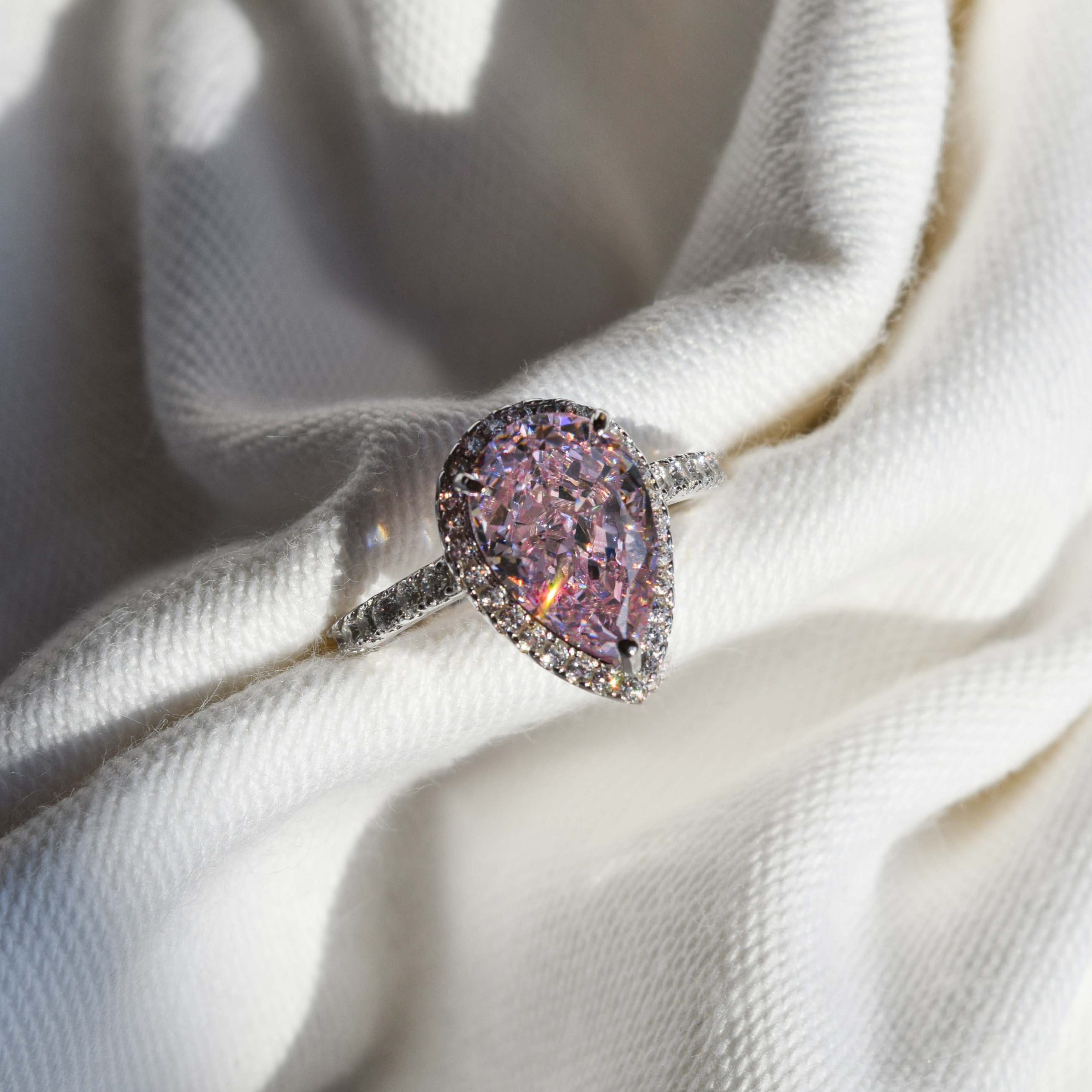 HALO PEAR CUT PINK ZIRCON STERLING SILVER RING