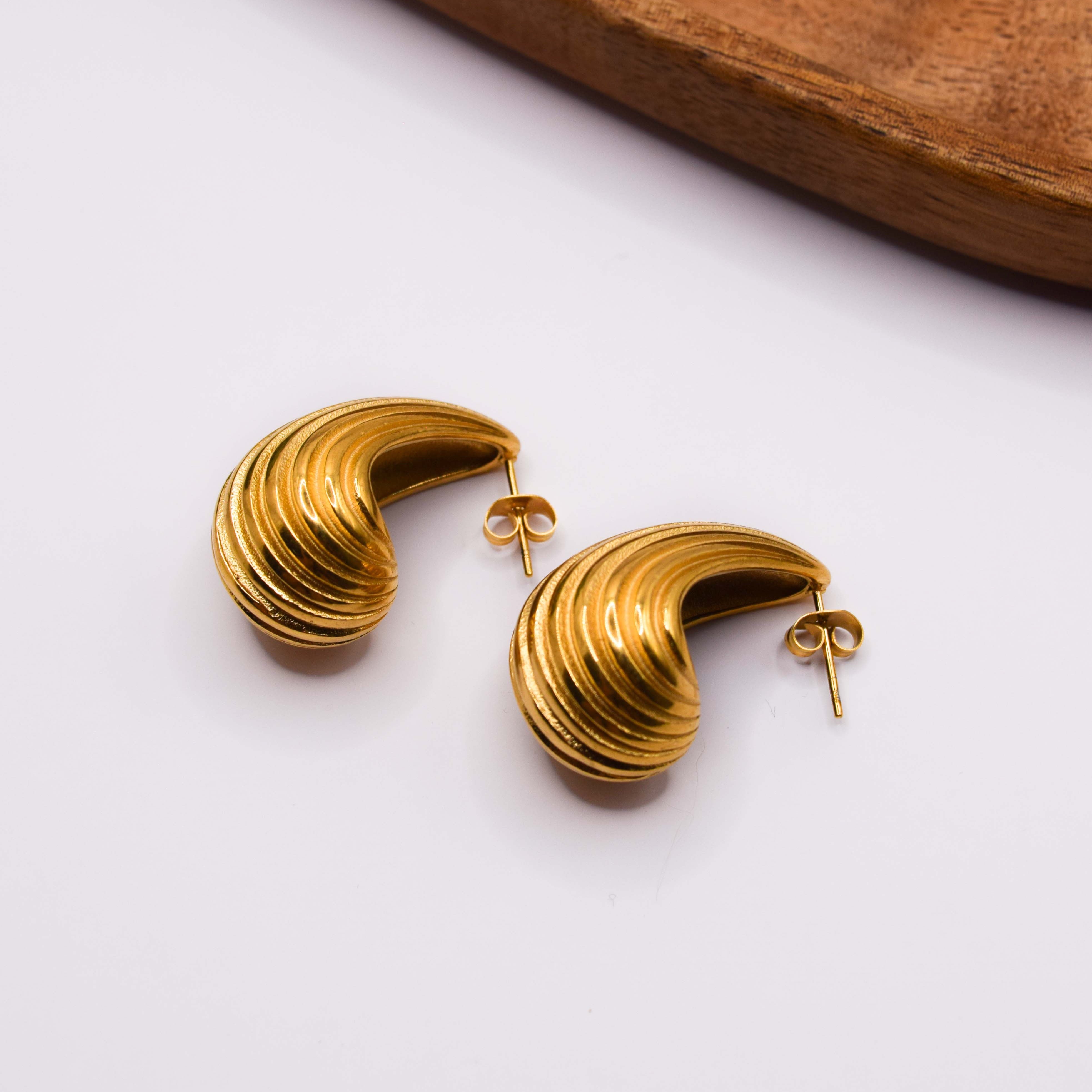 aretes concha gota en acero inoxidable