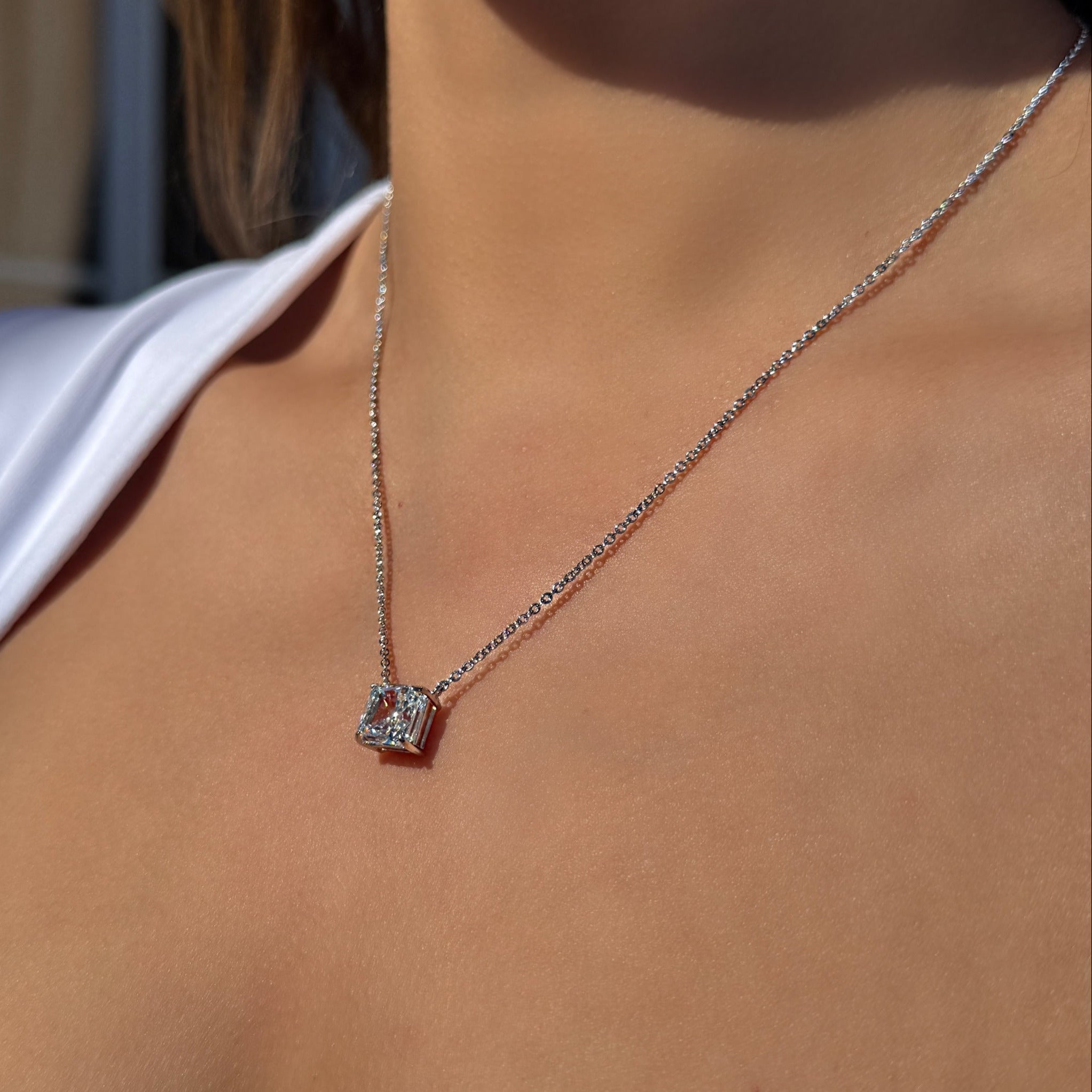 stainles steel necklace with emerald cut zircon